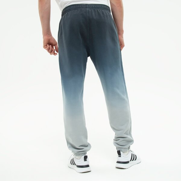 Spodnie dresowe męskie NIKE SPODNIE M NK CLUB+ CF PANT DIP DYE dq4631-070 kolor szary