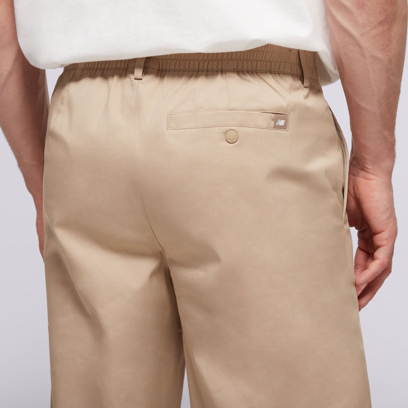 Spodnie dresowe męskie NEW BALANCE SPODNIE ATHLETICS STANDARD PANT 30" mp43560sot kolor beżowy