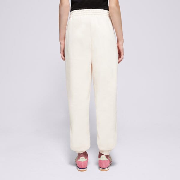 Spodnie dresowe damskie ADIDAS SPODNIE ESS JOGGERS iy9635 kolor biały