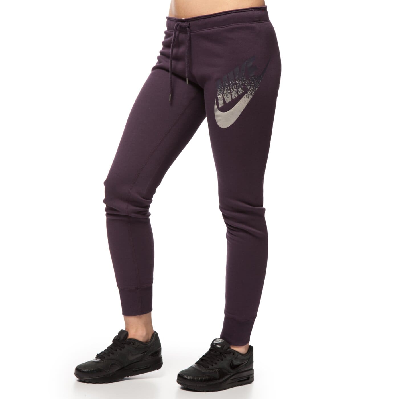 Spodnie dresowe damskie NIKE SPODNIE RALLY PANT TIGHT 678852507 kolor fioletowy
