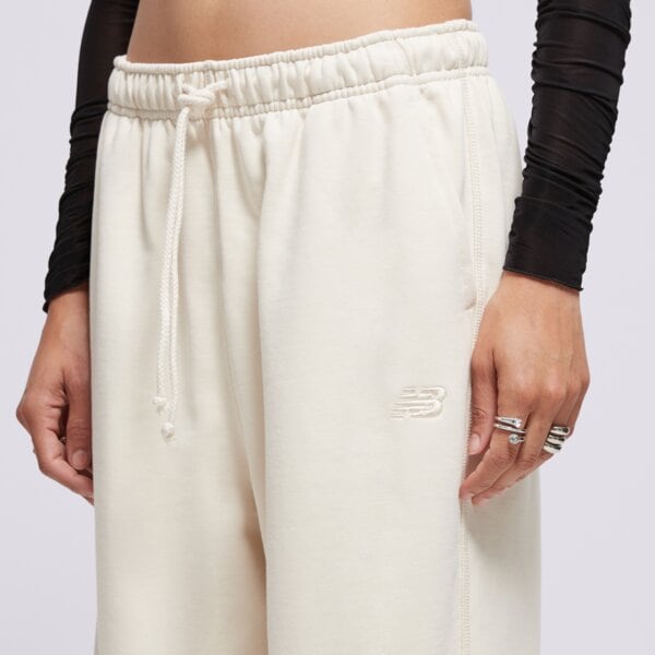 Spodnie dresowe damskie NEW BALANCE SPODNIE ATHLETICS FRENCH TERRY JOGGER wp41513lin kolor beżowy