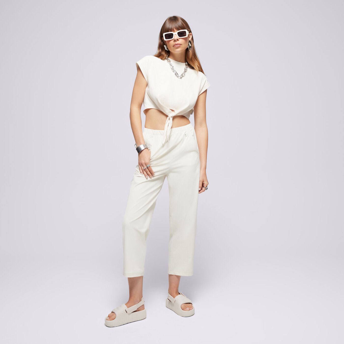 Spodnie dresowe damskie CHAMPION SPODNIE WIDE LEG ECO FUTURE 117110ys137 kolor beżowy