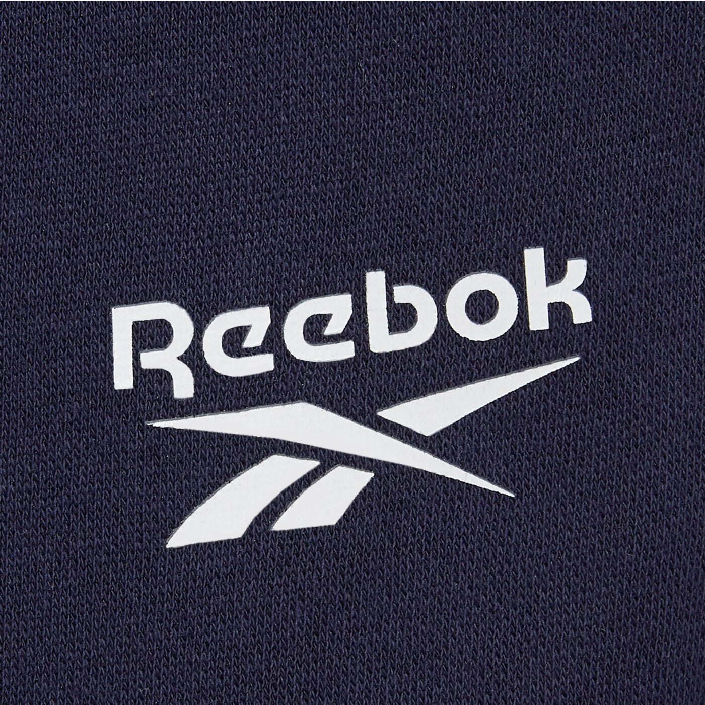 Spodnie dresowe męskie REEBOK SPODNIE ANDRE SMALL LOGO CUFFED PANT 100240235 kolor granatowy