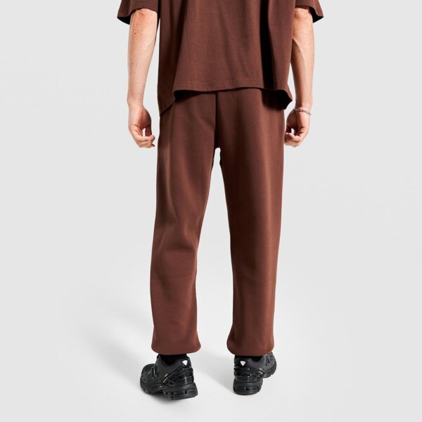 Spodnie dresowe męskie REEBOK SPODNIE PHILLIP VARSITY 100241203 kolor brązowy