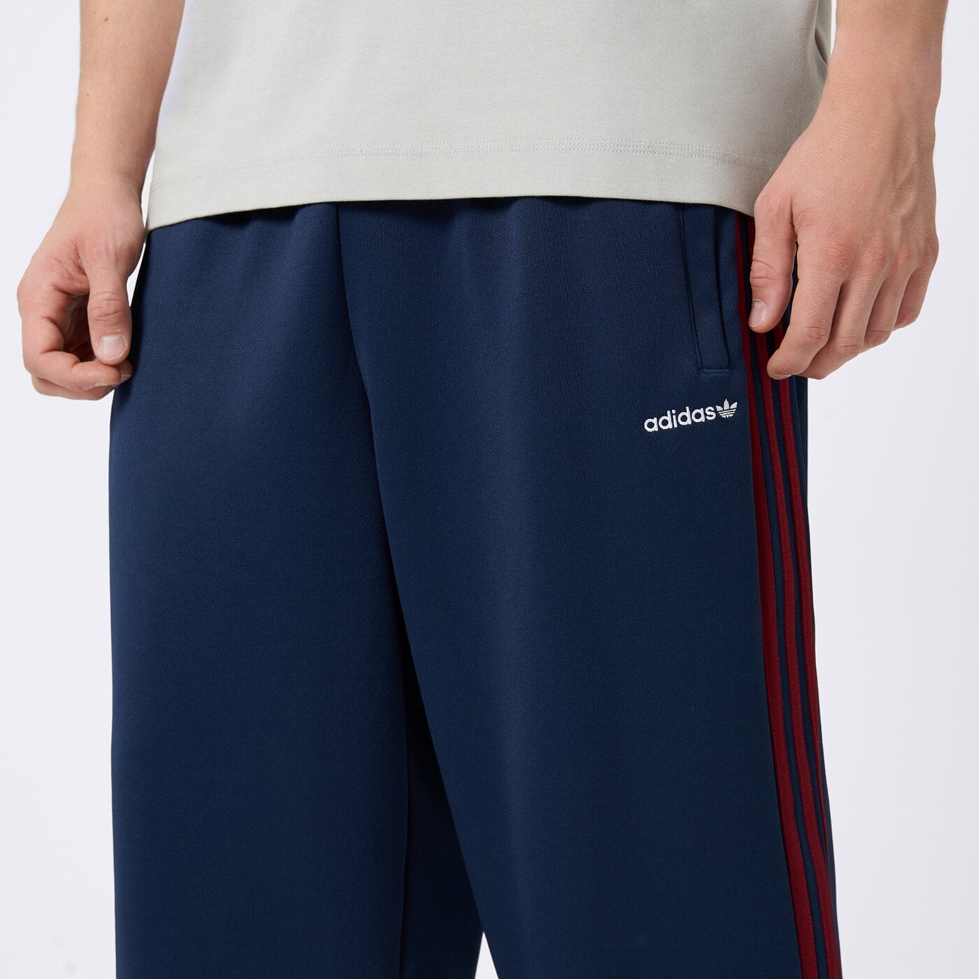 Spodnie dresowe męskie ADIDAS SPODNIE FIRST TP kd9117 kolor granatowy