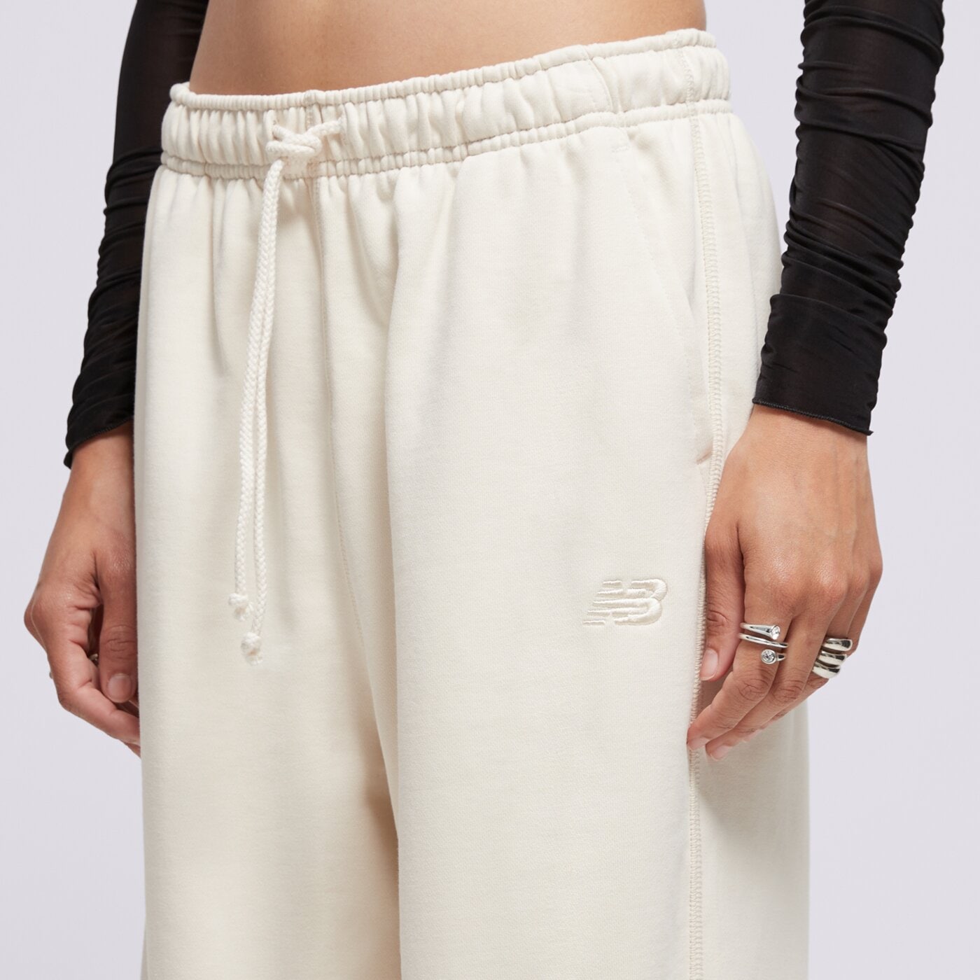 Spodnie dresowe damskie NEW BALANCE SPODNIE ATHLETICS FRENCH TERRY JOGGER wp41513lin kolor beżowy