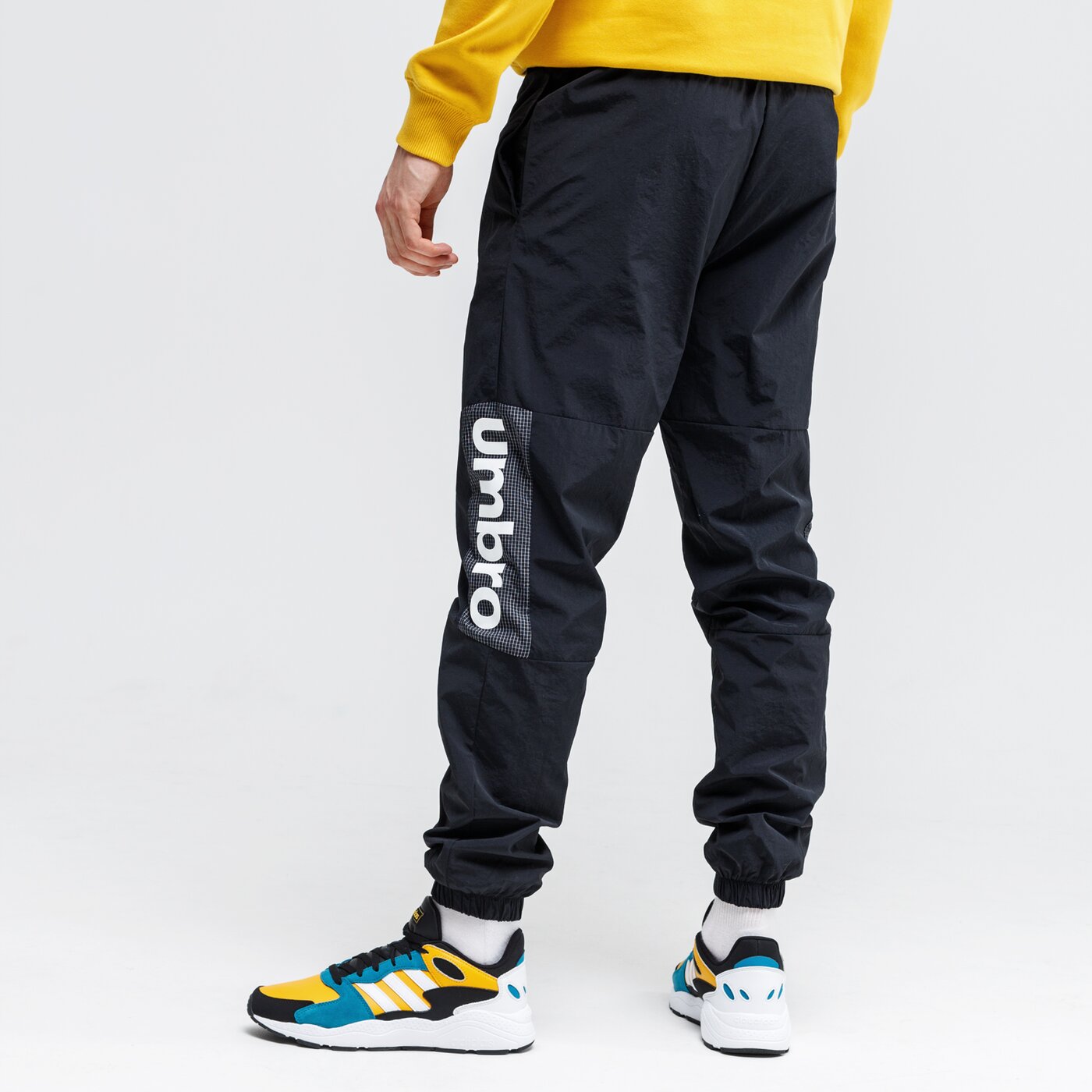 Spodnie dresowe męskie UMBRO SPODNIE WOVEN TRACK 65701u-060 kolor czarny