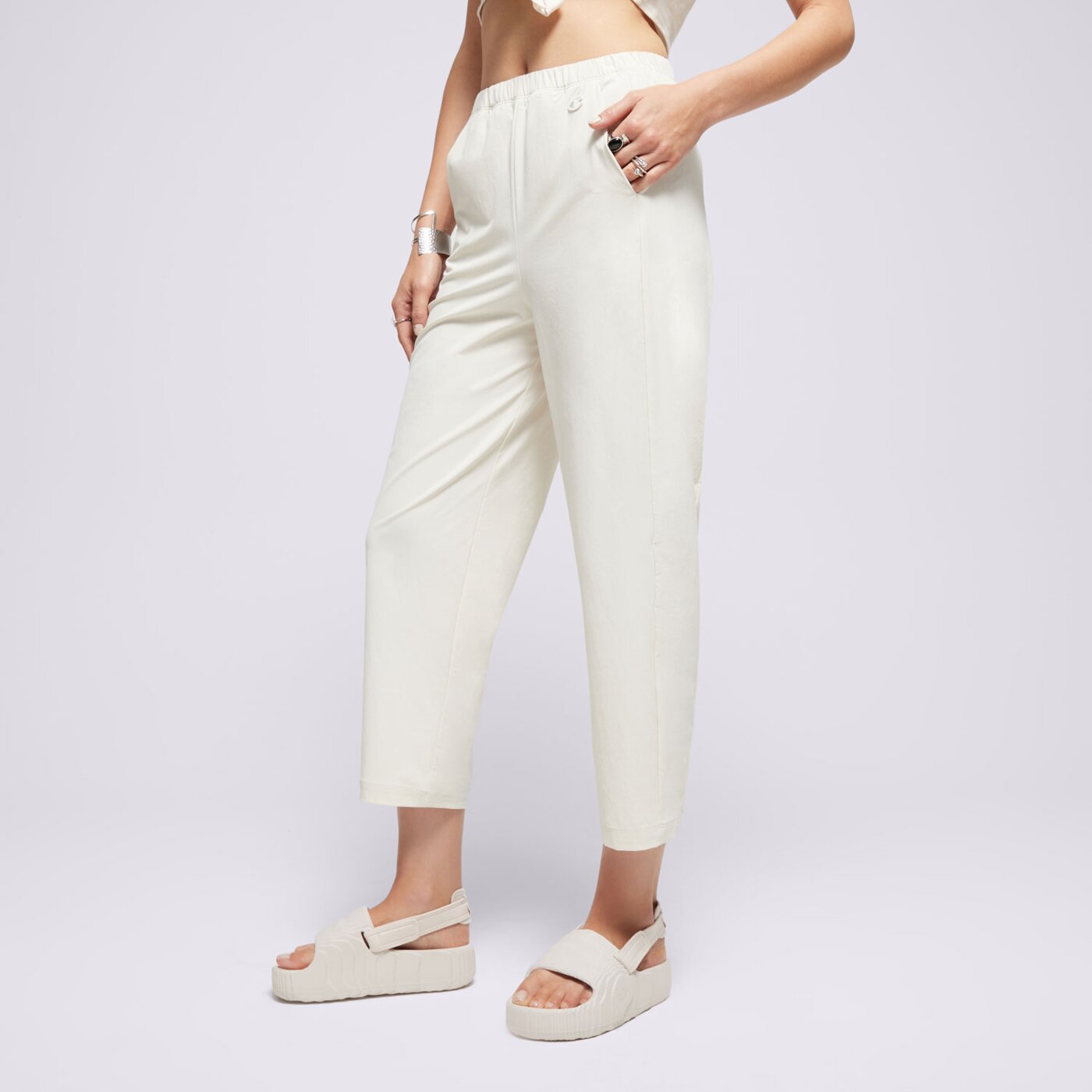 Spodnie dresowe damskie CHAMPION SPODNIE WIDE LEG ECO FUTURE 117110ys137 kolor beżowy