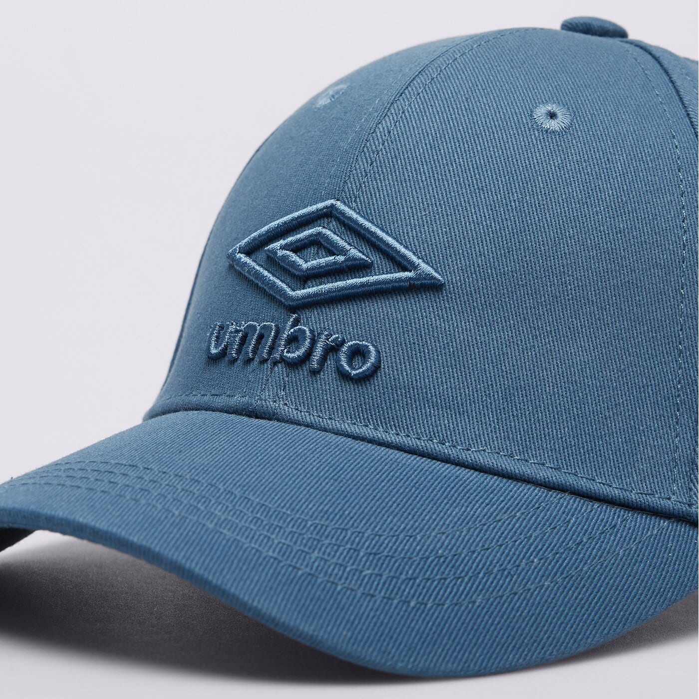 ★UMBRO★ Late Check-out Half-Plate Cap Blue UQ123CCP33 UQ12 UMBRO CZAPKA Z DASZKIEM GAMATA (UL124CAP10002) niebieski