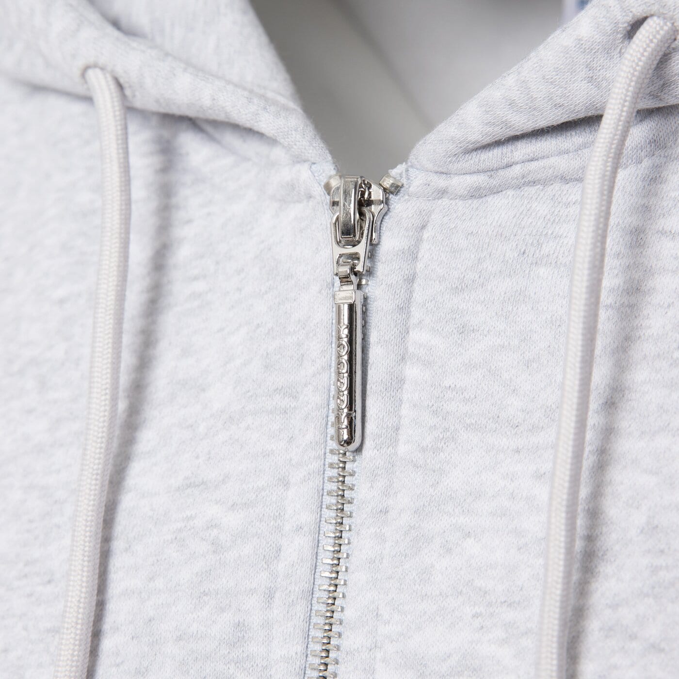 Bluza damska REEBOK BLUZA ROZPINANA Z KAPTUREM ARIANA THROUGH 100241270 kolor szary