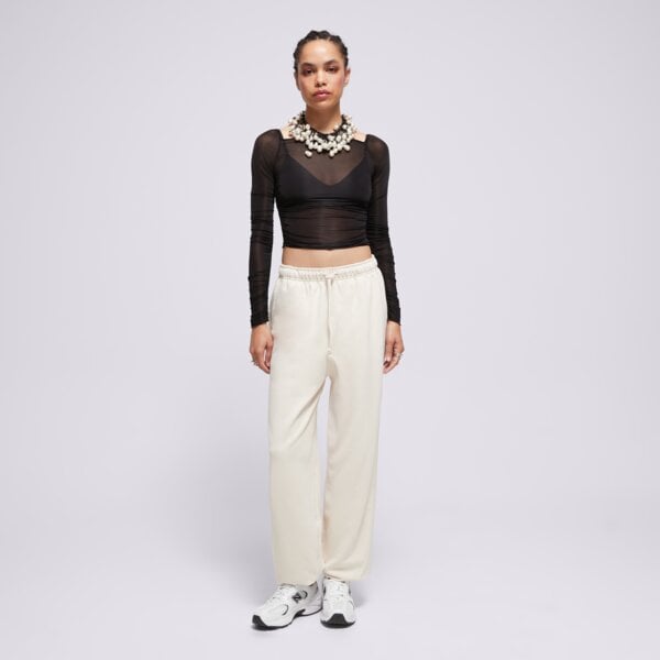 Spodnie dresowe damskie NEW BALANCE SPODNIE ATHLETICS FRENCH TERRY JOGGER wp41513lin kolor beżowy