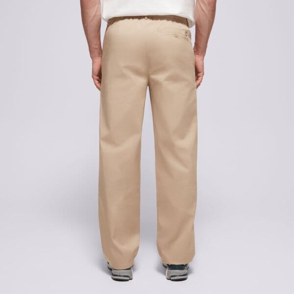 Spodnie dresowe męskie NEW BALANCE SPODNIE ATHLETICS STANDARD PANT 30" mp43560sot kolor beżowy