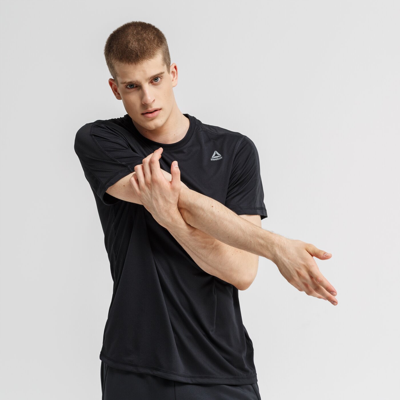 Koszulka męska REEBOK T-SHIRT WOR TECH TOP - REGULAR du2183 kolor czarny