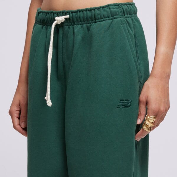 Spodnie dresowe damskie NEW BALANCE SPODNIE ATHLETICS FRENCH TERRY JOGGER wp41513nwg kolor zielony